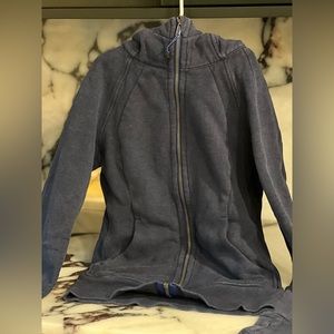 This is a Lululemon full zip scuba. It is a dark blue. Worn, but like new